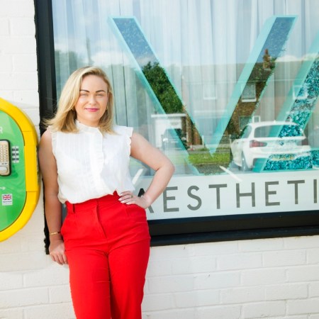 VL Aesthetics Clinic has defibrillator installed with Managing Director Vanessa Brown standing with it - Jenny Woolgar