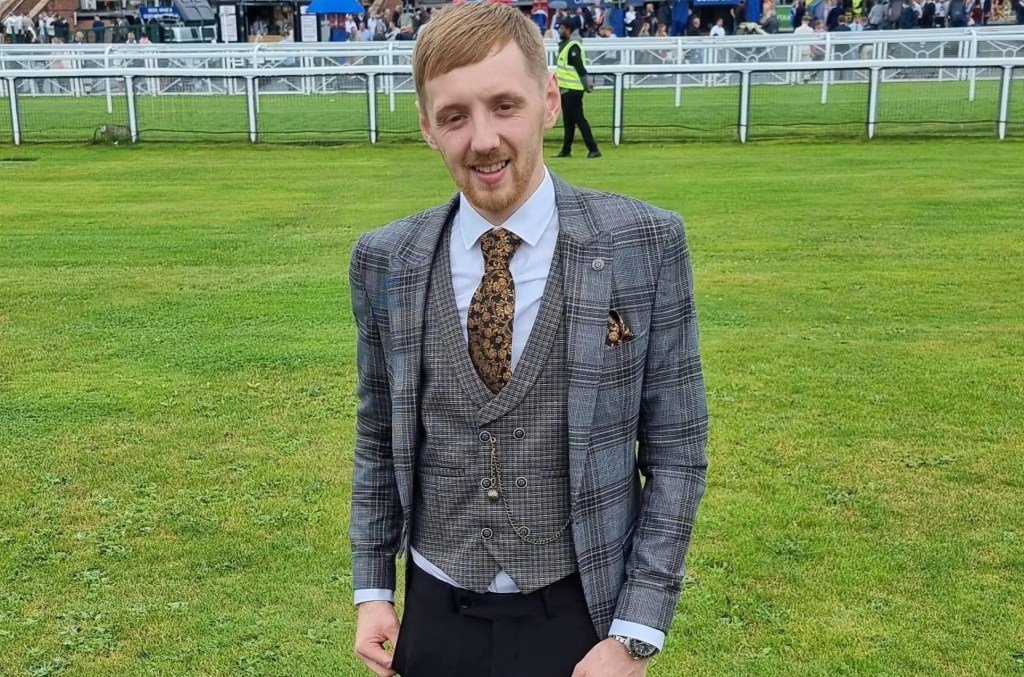 Sheldon Morfoot in grey plaid suit